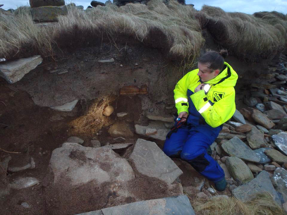 Carrie with 4000 year old remains that she uncovered on the isle of Sanday.